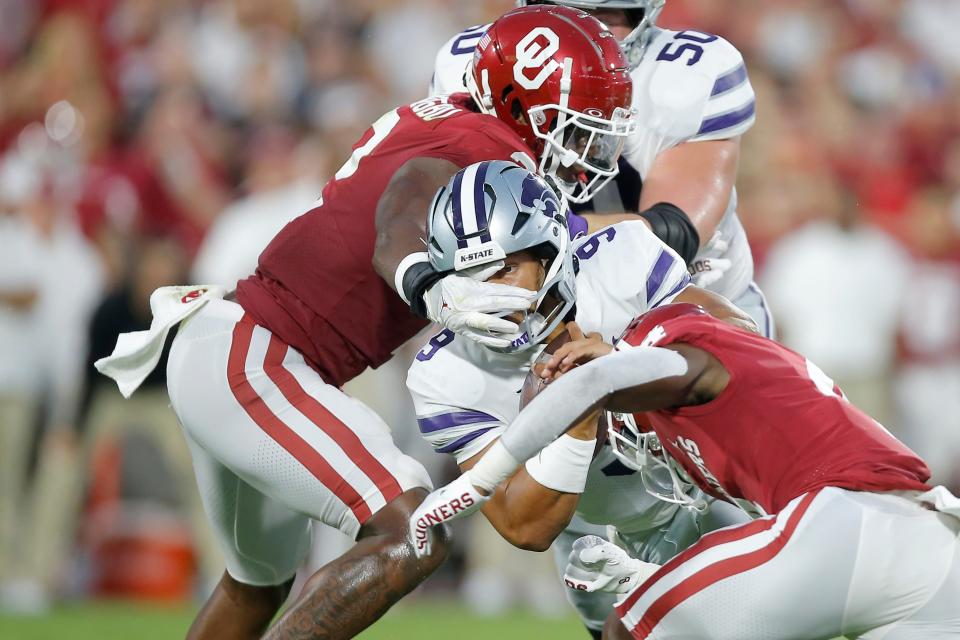 Oklahoma's David Ugwoegbu (2) is called for a facemask penalty as he tries to bring down Kasnas State's Adrian Martinez (9) during a college football game between the University of Oklahoma Sooners (OU) and the Kansas State Wildcats at Gaylord Family - Oklahoma Memorial Stadium in Norman, Okla., Saturday, Sept. 24, 2022. Kansas State won 41-34.