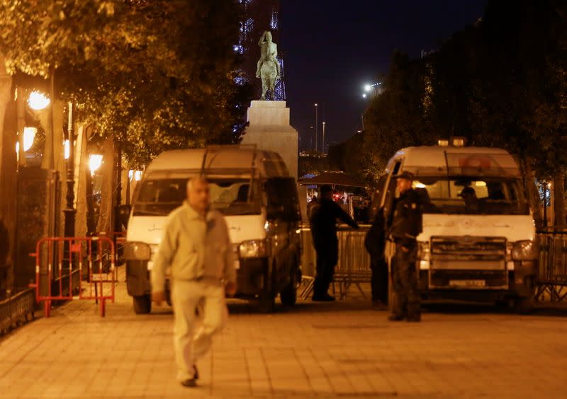 A police officer stands guard near the interior ministry in Tunis