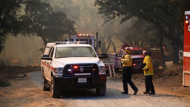PHOTO: Firefighters coordinate the ground fire attack on the Rices Fire, June 28, 2022, off of Troost Trail, in North San Juan, Calif. (Elias Funez/The Union via AP)