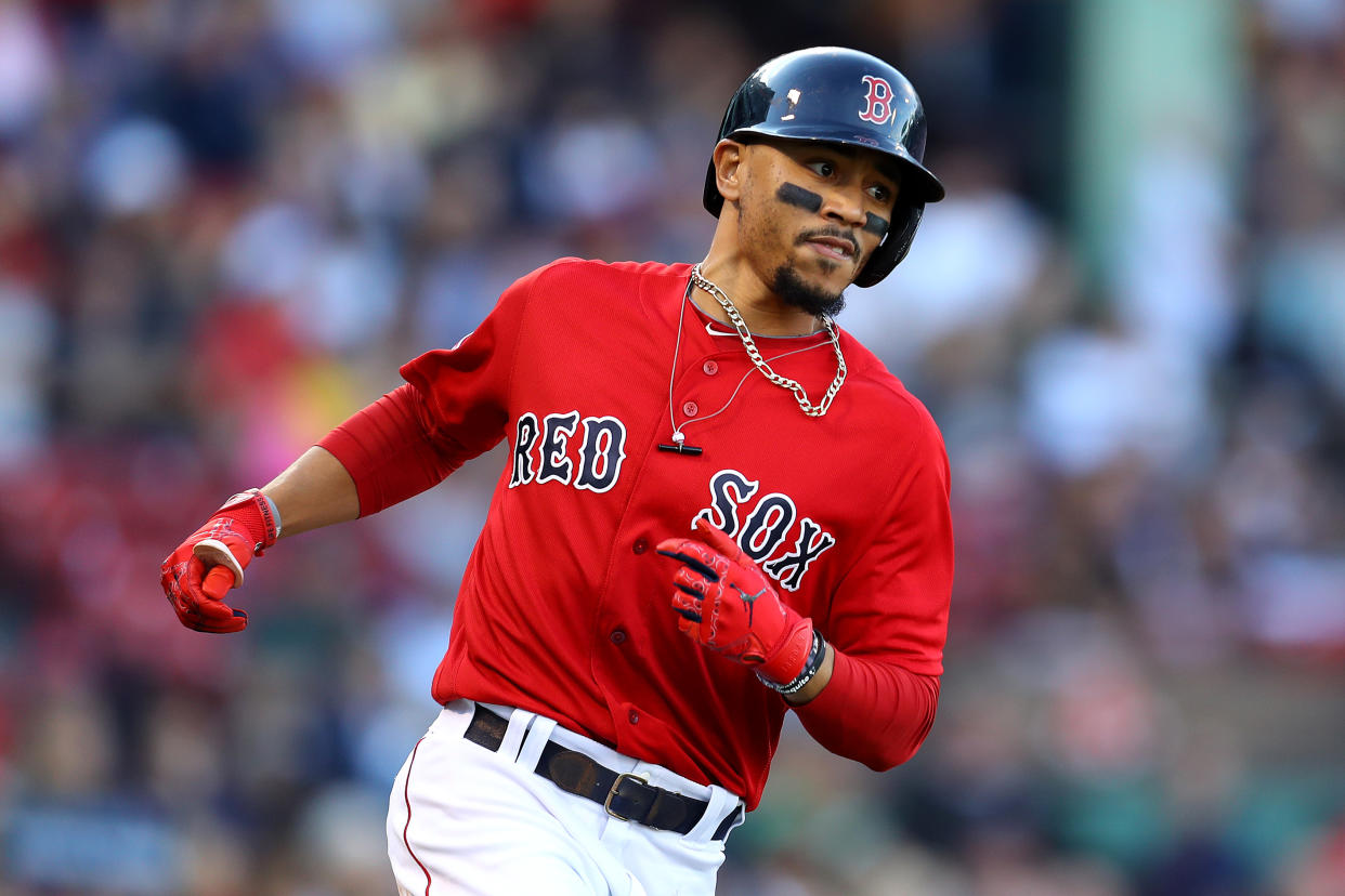 BOSTON, MASSACHUSETTS - SEPTEMBER 29: Mookie Betts #50 of the Boston Red Sox runs to first base during the fifth inning against the Baltimore Orioles at Fenway Park on September 29, 2019 in Boston, Massachusetts. (Photo by Maddie Meyer/Getty Images)