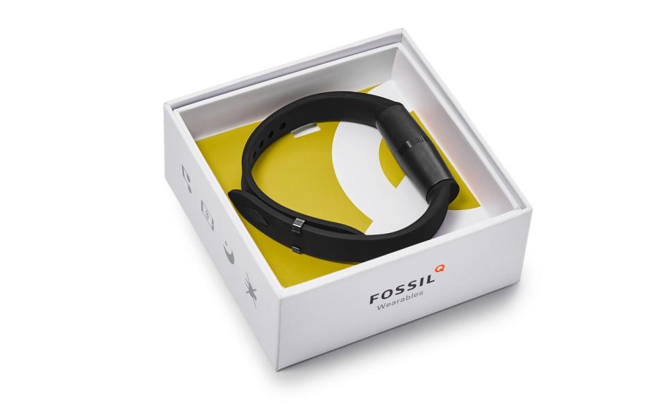 Wearable device in a white and yellow box with Fossil's logo.