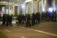 <p>Bomb sniffing dogs and police walk outside a hotel at the Resorts World Manila complex, early Friday, June 2, 2017, in Manila, Philippines. (Photo: Aaron Favila/AP) </p>