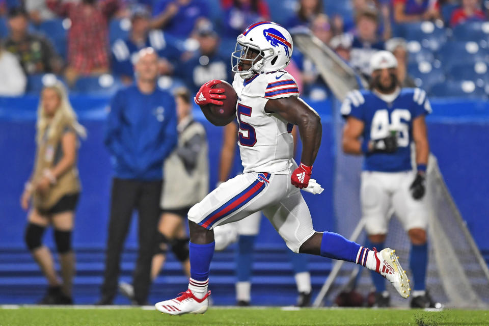 Buffalo Bills' Christian Wade runs the ball for a touchdown during the second half of an NFL preseason football game against the Indianapolis Colts, Thursday, Aug. 8, 2019, in Orchard Park, N.Y. Wade gave up a promising career representing England in rugby to give American football a try. On his first play from scrimmage in a competitive setting, the 28-year-old from Slough _ best known for home of the BBC's version of "The Office" sitcom _ scored a touchdown on a 65-yard run to help the Buffalo Bills secure a 24-16 preseason-opening win over Indianapolis. (AP Photo/Adrian Kraus)