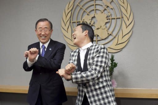 South Korean rapper Psy, right, teaches UN leader Ban Ki-moon some of his famous dance routines