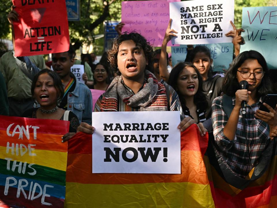 Members of the Student Federation of India (SFI) along with LGBT activist hold placards and shout slogans during a protest march against India's Supreme Court verdict on same-sex marriage, in New Delhi on October 18, 2023.
