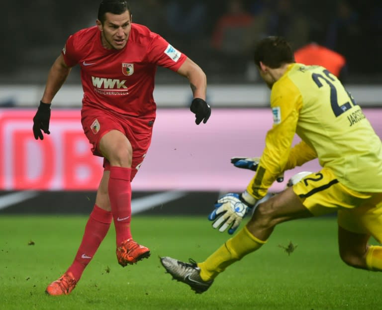 Augsburg's Paraguayan forward Raul Bobadilla (left) nearly scores past Hertha's Norwegian goalkeeper Rune Jarstein during their Bundesliga match in Berlin, on January 23, 2016