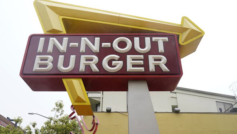 The sign to an In-N-Out restaurant is shown in San Francisco’s Fisherman’s Wharf, Wednesday, Oct. 20, 2021.