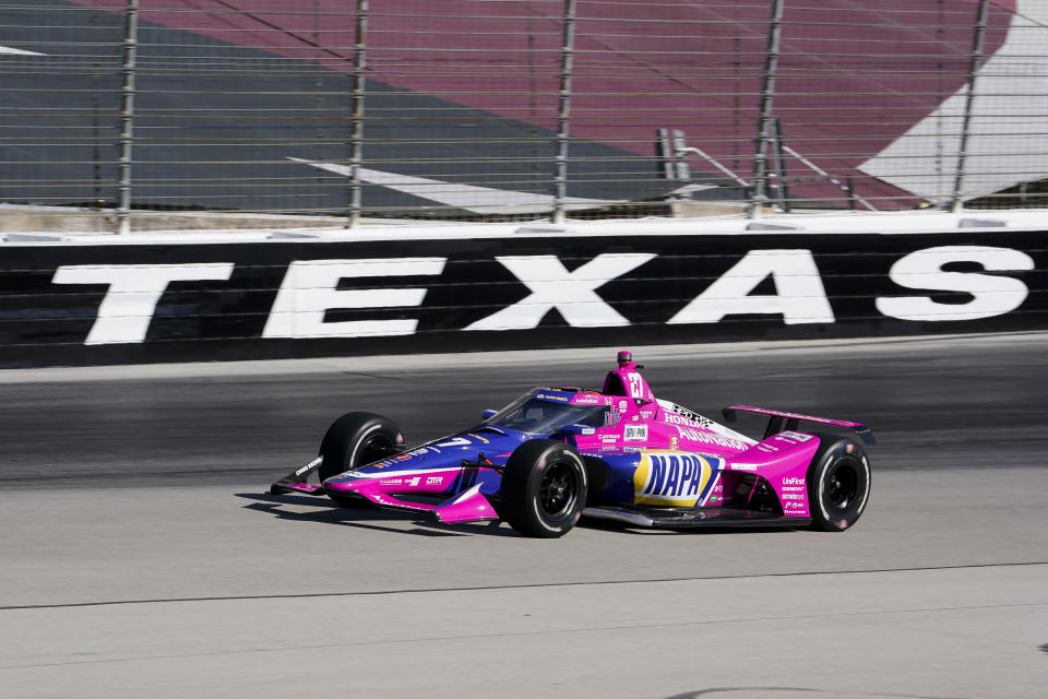 Alexander Rossi rounds the fourth turn during the first practice round of the IndyCar Series auto race at Texas Motor Speedway in Fort Worth, Texas on Saturday, March 19, 2022. (AP Photo/Larry Papke)