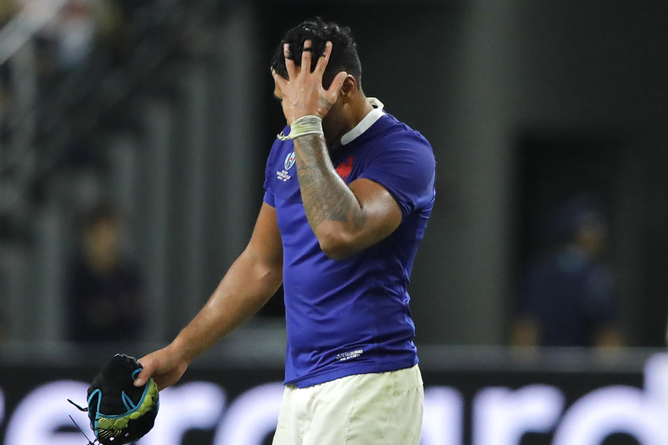 France's Sebastien Vahaamahina leaves the field after receiving a red card during the Rugby World Cup quarterfinal match at Oita Stadium in Oita, Japan, Sunday, Oct. 20, 2019. (AP Photo/Christophe Ena)