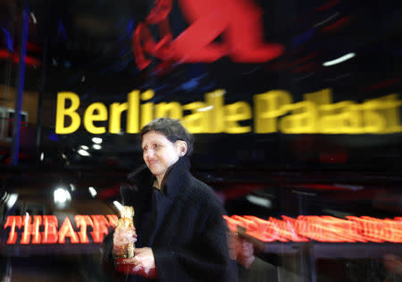 Director, screenwriter, editor and producer Adina Pintilie poses with her Golden Bear award for Best Film Touch Me Not during the awards ceremony at the 68th Berlinale International Film Festival in Berlin, Germany, February 24, 2018. REUTERS/Hannibal Hanschke