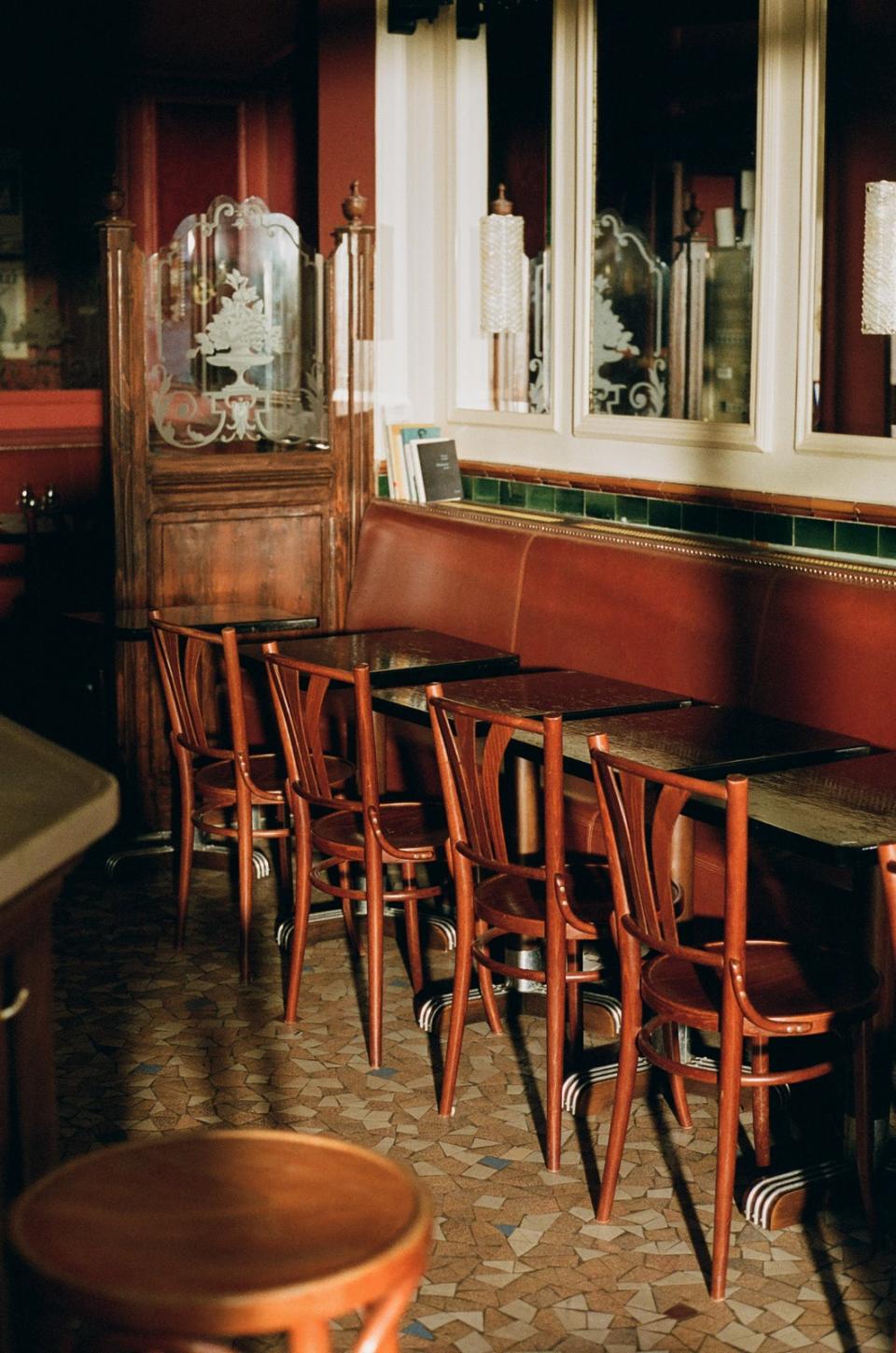 The original cognac-colored banquette has been restored.