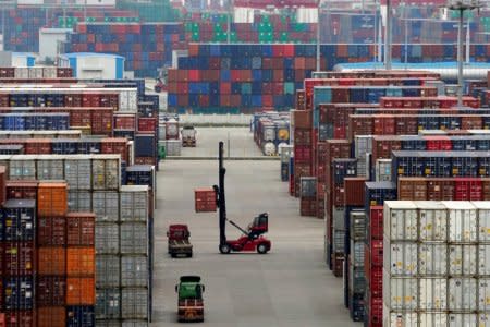 FILE PHOTO: Containers are seen at the Yangshan Deep Water Port in Shanghai, China April 24, 2018. REUTERS/Aly Song/File Photo