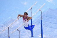 Artur Dalaloyan, of the Russian Olympic Committee, performs on the parallel bars during men's artistic gymnastics team final at the 2020 Summer Olympics, Monday, July 26, 2021, in Tokyo, Japan. (AP Photo/Jeff Roberson)