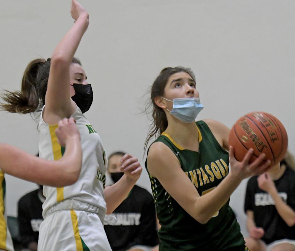 Tantasqua's Nicole Vejack drives to the hoop after getting past Notre Dame's Dana Woodward.