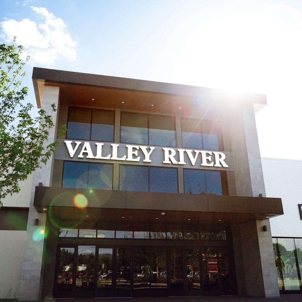 Bystanders subdued a man who stabbed a woman outside Valley RIver Center in Eugene, police say.