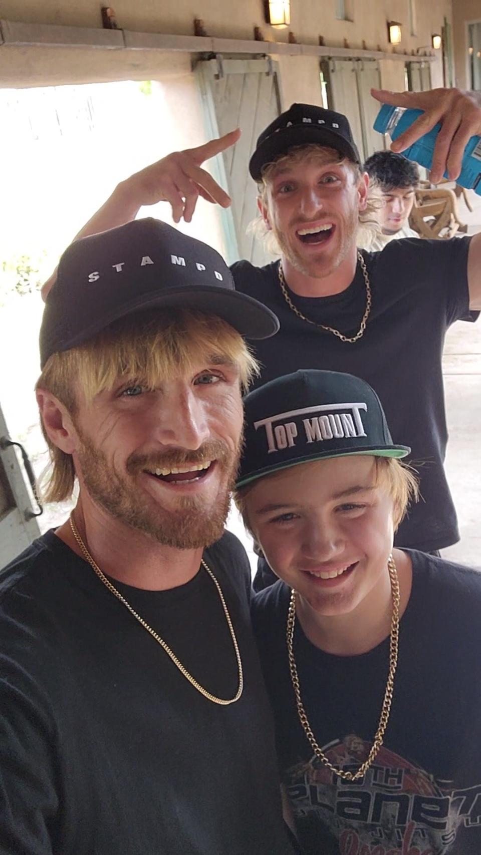 A picture of Rodney and his son meeting Logan Paul.