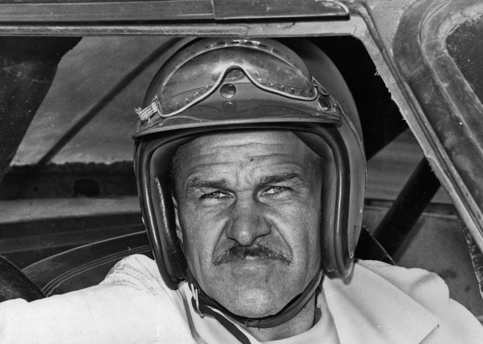 FILE - In this Aug. 1, 1969, file photo, Wendell Scott sits in a race car. Bubba Wallace became just the second Black driver to win at NASCAR’s top Cup Series level when rain stopped the playoff race at Talladega Superspeedway. Wallace is the first Black driver to win at NASCAR’s elite Cup level since Scott in 1963. (AP Photo/File)