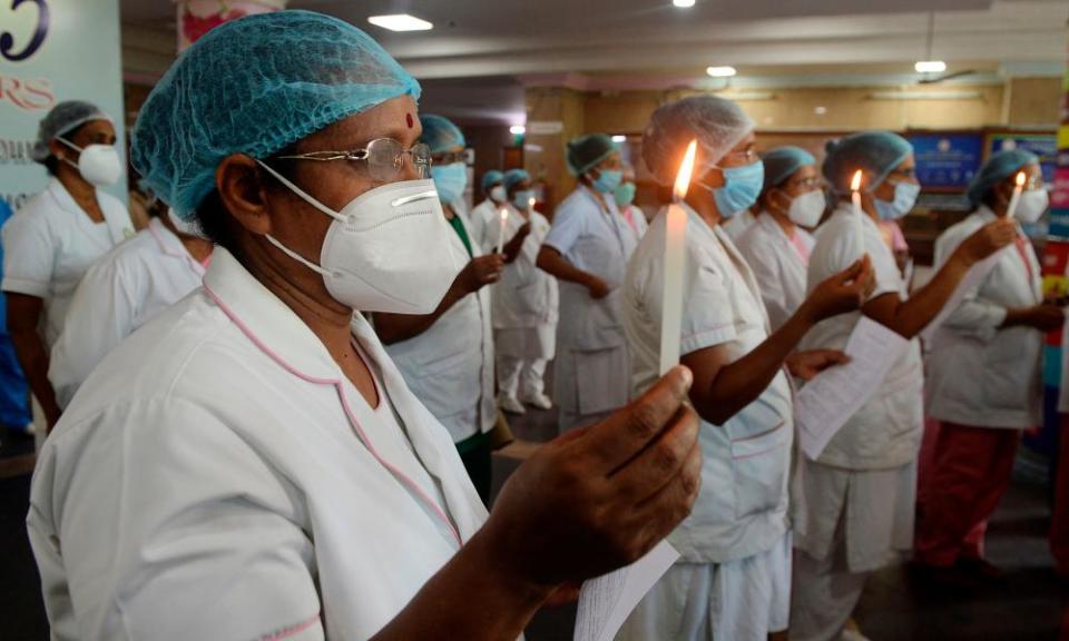 Nurses light candles at Rajiv Gandhi hospital in Kochi to mark international nurses day.