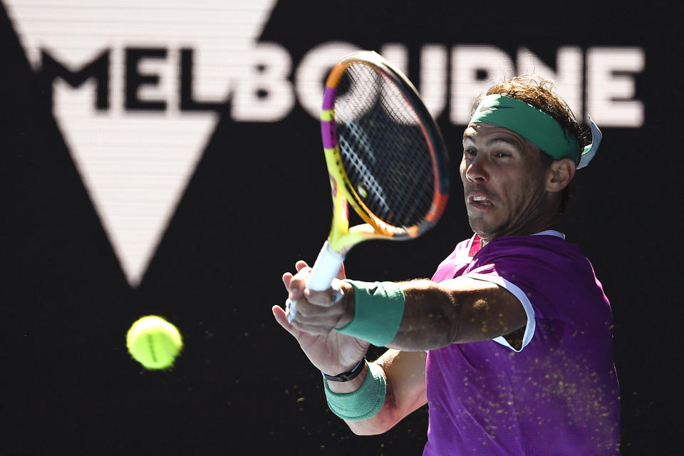 Rafael Nadal of Spain plays a forehand return to Yannick Hanfmann of Germany during their second round match at the Australian Open tennis championships in Melbourne, Australia, Wednesday, Jan. 19, 2022. (AP Photo/Andy Brownbill)