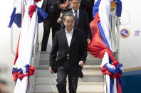 China's Foreign Minister Wang Yi arrives at Wattay Airport for the Special ASEAN-China Foreign Ministers' Meeting on the coronavirus disease 2019 (COVID-19) in Vientiane, Laos, Wednesday, Feb. 19, 2020. (AP Photo/Sakchai Lalit)