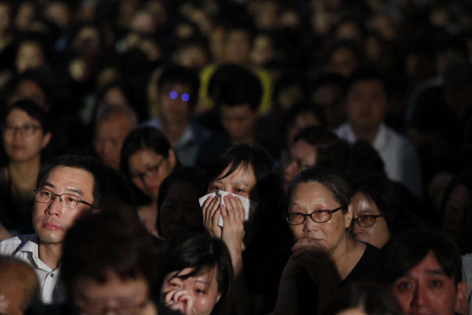 A woman cries as she joins a rally by mothers in support of student protesters in Hong Kong on Friday, Jan. 5, 2019. Student unions from two Hong Kong universities said Friday that they have turned down invitations from city leader Carrie Lam for talks about the recent unrest over her proposal to allow the extradition of suspects to mainland China. (AP Photo/Andy Wong)