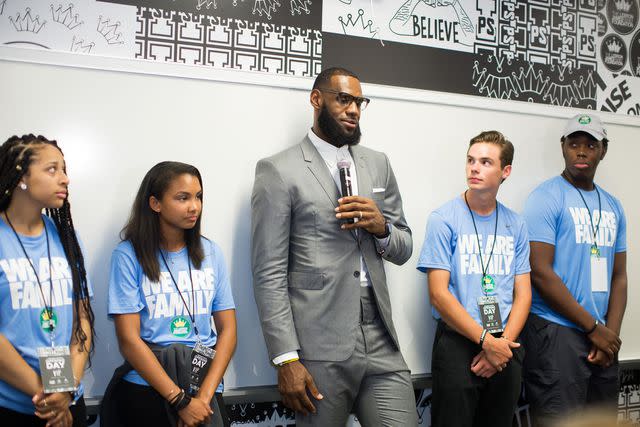 <p>Allison Farrand/NBAE via Getty</p> CENTER: LeBron James at I PROMISE grand opening in 2018