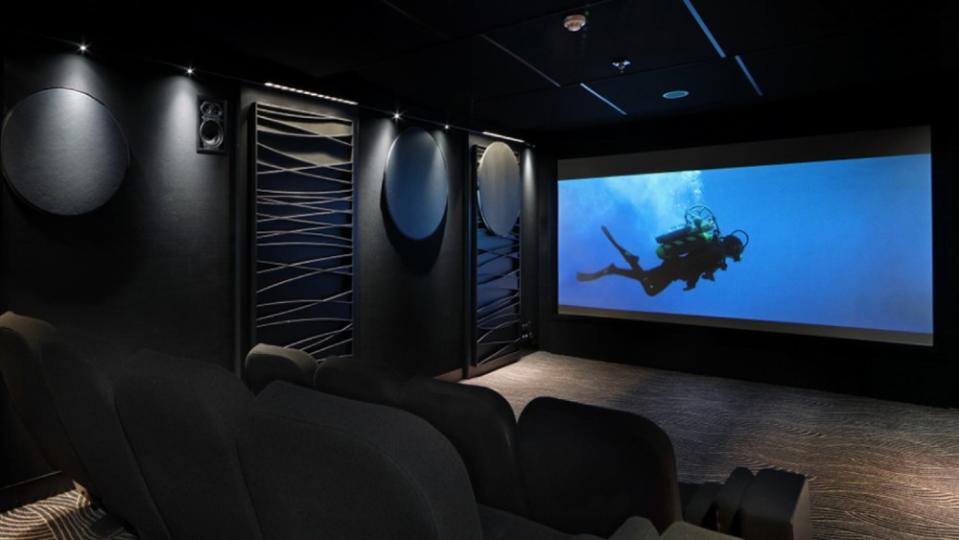 Who needs a movie screen when you have a window beneath the ocean’s surface? - Credit: Courtesy Fraser Yachts