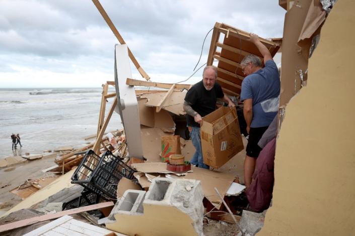 Photo of people removing debris
