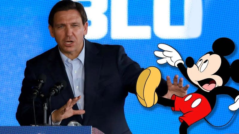 A photo shows DeSantis pushing a cartoon drawing of Mickey Mouse. 