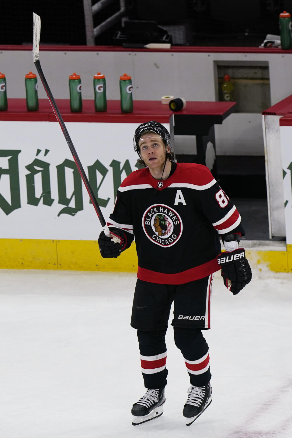 Chicago Blackhawks right wing Patrick Kane looks up the scoreboard as he celebrates his 400th career goal after the team defeated the Detroit Red Wings in an NHL hockey game in Chicago, Sunday, Feb. 28, 2021. (AP Photo/Nam Y. Huh)