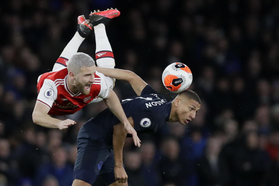 Everton's Richarlison, right, fights for the ball with Arsenal's Shkodran Mustafi during the English Premier League soccer match between Arsenal and Everton at Emirates stadium in London, Sunday, Feb. 23, 2020. (AP Photo/Kirsty Wigglesworth)