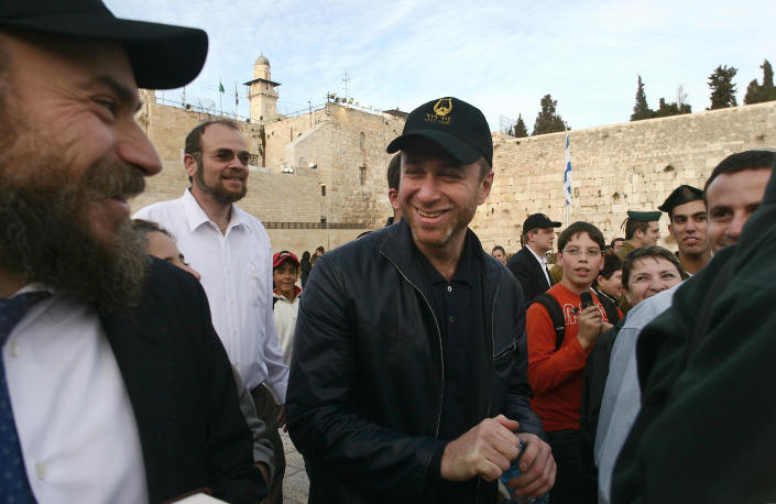 Roman Abramovich stands among a crowd of visitors to the Western Wall in Jerusalem.