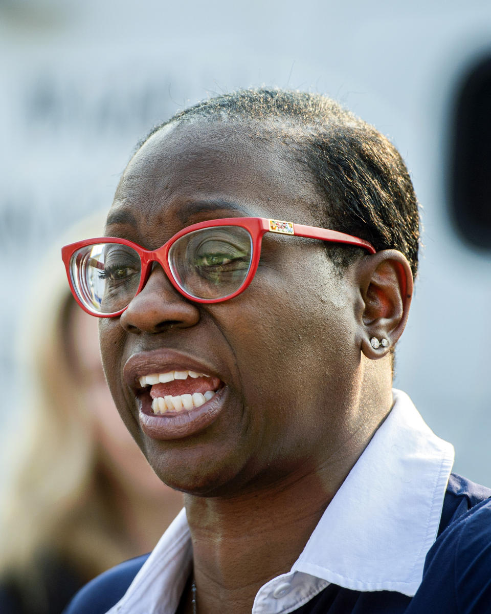 In this July 7, 2021, photo Nina Turner, a candidate running in a special Democratic primary election for Ohio's 11th Congressional District speaks with supporters near the Cuyahoga County Board of Elections before casting her vote in Cleveland. (AP Photo/Phil Long)