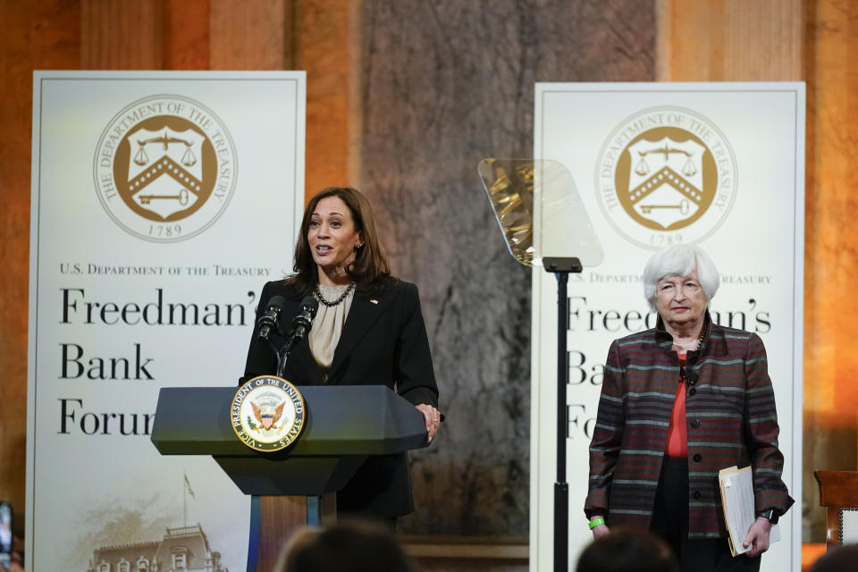 FILE - Vice President Kamala Harris speaks during the Freedman Bank Forum as Treasury Secretary Janet Yellen look on in Washington, Dec. 14, 2021. Vice President Kamala Harris and Treasury Secretary Janet Yellen will host Treasury's annual Freedman's Bank Forum, October 6. (AP Photo/Carolyn Kaster, File)