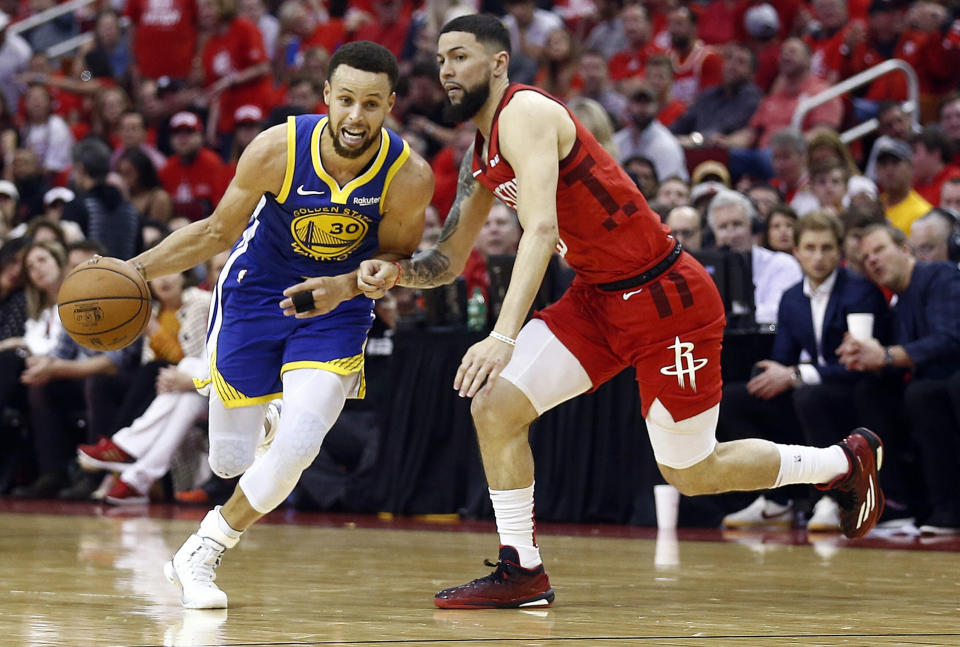 HOUSTON, TEXAS - MAY 10: Stephen Curry #30 of the Golden State Warriors rives around Austin Rivers #25 of the Houston Rockets during Game Six of the Western Conference Semifinals of the 2019 NBA Playoffs at Toyota Center on May 10, 2019 in Houston, Texas. NOTE TO USER: User expressly acknowledges and agrees that, by downloading and or using this photograph, User is consenting to the terms and conditions of the Getty Images License Agreement. (Photo by Bob Levey/Getty Images)