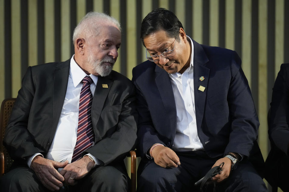 Brazilian President Luiz Inacio Lula da Silva, left, talks with Bolivia's President Luis Arce during the 63rd Mercosur Summit, in Rio de Janeiro, Brazil, Thursday, Dec. 7, 2023. (AP Photo/Silvia Izquierdo)