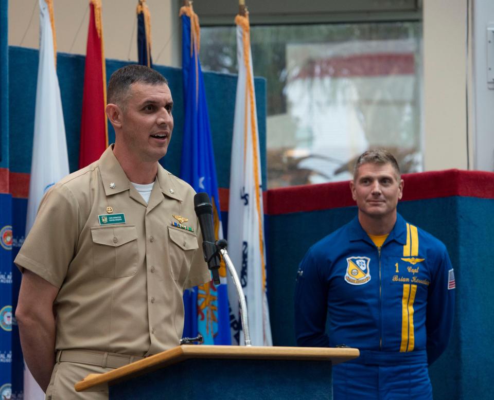 Cmdr. Alex "Scribe" Armatas, left, speaks to the media Tuesday after being selected as the commanding officer for the Blue Angels for the team's 2023 and 2024 air show seasons. The current commanding officer, Capt. Brian Kesselring, looks on during the press conference at the National Naval Aviation Museum at NAS Pensacola.
