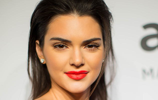 Kendall Jenner rocks a red lip.