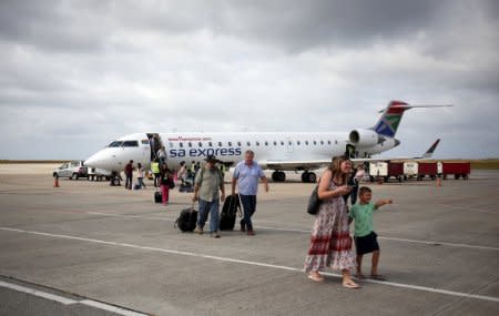 Passengers alight from a South African Airways at George Airport in the Western Cape, South Africa. December 14, 2017. Picture taken December 14, 2017. REUTERS/Siphiwe Sibeko