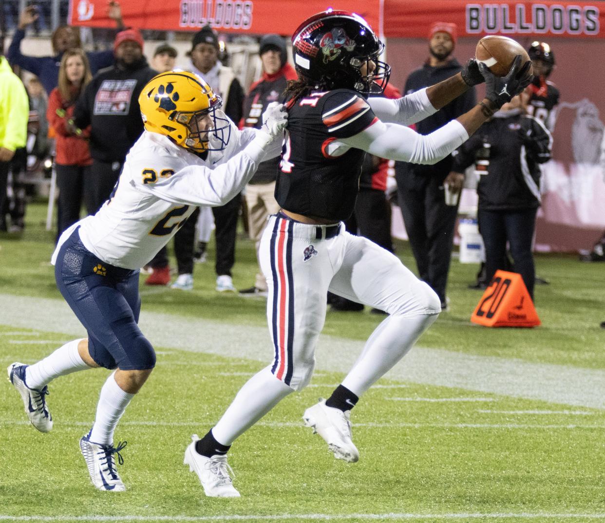 McKinley’s Keith Quincy makes a reception in front of St. Ignatius’s Max Woidke for a touchdown to give McKinley a 21-3 lead Friday, Nov. 3, 2023.