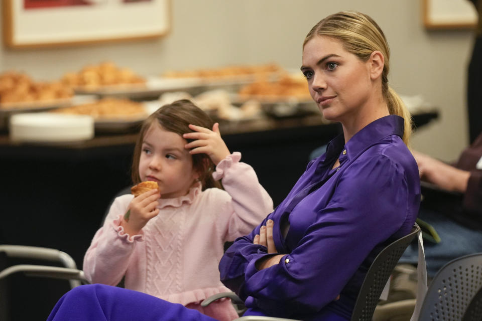 Kate Upton, and her daughter Genevieve, watch as her husband Justin Verlander participates in a baseball news conference at Citi Field, Tuesday, Dec. 20, 2022, in New York. The team introduced Verlander at a news conference after they agreed to a $86.7 million, two-year contract. It's part of an offseason spending spree in which the Mets have committed $476.7 million on seven free agents. (AP Photo/Seth Wenig)