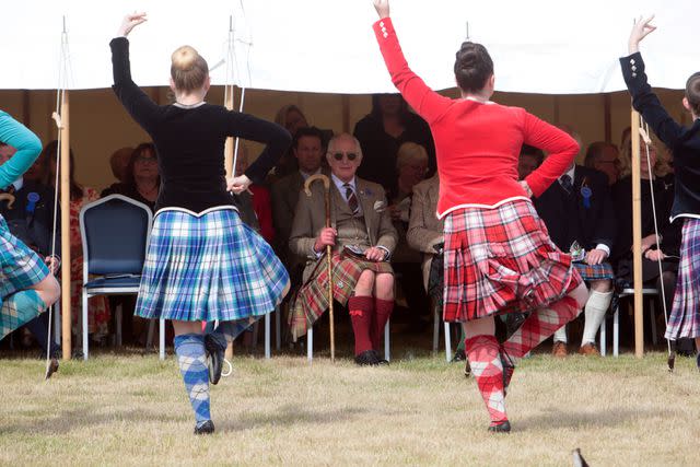 <p>Robert MacDonald/PA Images via Getty Images</p> The monarch also took in the highland dancing