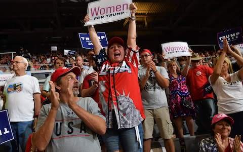 The crowd broke into chants of "send her back", in reference to Mr Trump's tweets condemned as racist - Credit: AFP