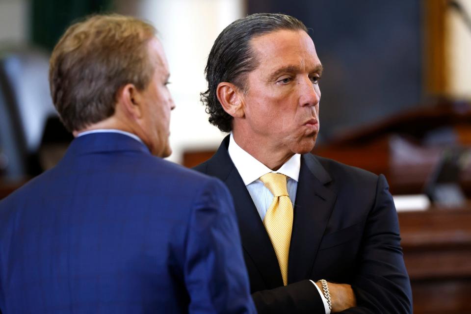 Defense attorney Tony Buzbee, right, stands with suspended Texas Attorney General Ken Paxton at the beginning of Paxton’s impeachment trial Tuesday.