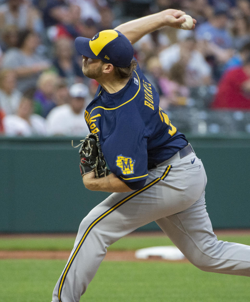 Milwaukee Brewers starting pitcher Corbin Burnes throws to strike out Cleveland Indians' Franmil Reyes during the fifth inning of a baseball game in Cleveland, Saturday, Sept. 11, 2021. (AP Photo/Phil Long)