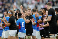 Players thank the crowd following the Rugby World Cup Pool B game at Tokyo Stadium between New Zealand and Namibia in Tokyo, Japan, Sunday, Oct. 6, 2019. The All Blacks defeated Namibia 71-9. (AP Photo/Christophe Ena)