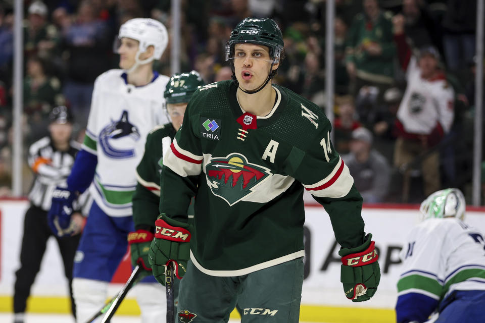 Minnesota Wild center Joel Eriksson Ek (14) celebrates his power play goal against the Vancouver Canucks during the third period of an NHL hockey game, Monday, Feb. 19, 2024, in St. Paul, Minn. (AP Photo/Matt Krohn)