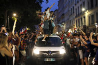 <p>French soccer fans,standing atop a car, celebrate their team victory after watching a live broadcast of the semifinal match between France and Belgium at the 2018 soccer World Cup, in Lyon, central France,Tuesday July 10, 2018. France has advanced to the World Cup final for the first time since 2006 with a 1-0 win over Belgium. (AP Photo/Laurent Cipriani) </p>
