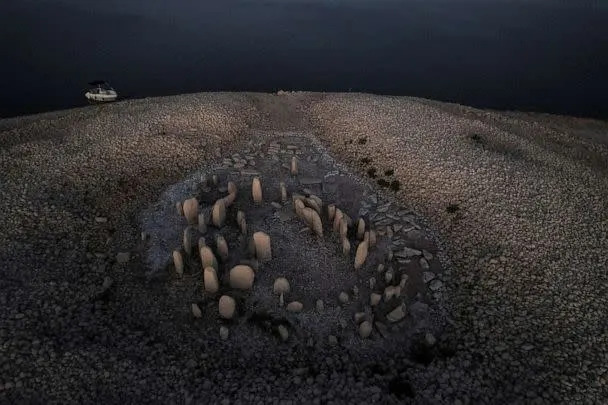 PHOTO: The dolmen of Guadalperal, also known as the Spanish Stonehenge, is revealed due to the receding waters of the Valdecanas reservoir in the outskirts of El Gordo, Spain, Aug, 3, 2022. (Susana Vera/Reuters)