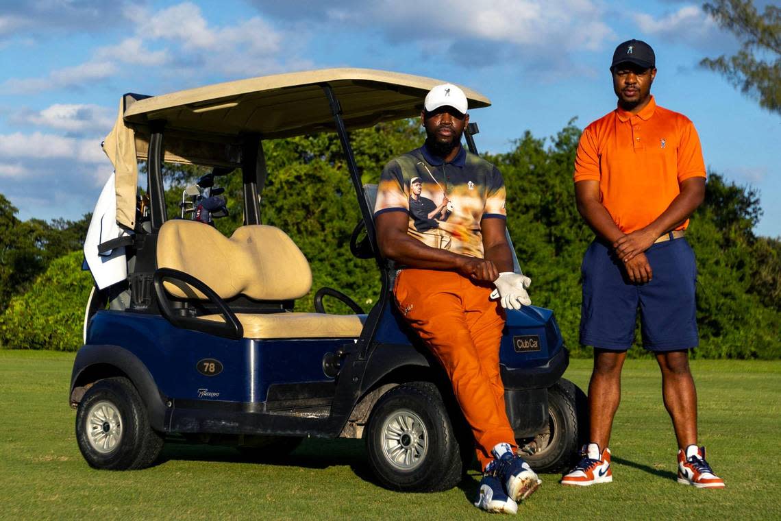 Eastside Golf founder Olajuwon Ajanaku and co-founder Earl A. Cooper strike a pose at Miami Springs Golf & Country Club in Miami Springs, Florida, on Saturday, Dec. 10, 2022. Eastside Golf is a lifestyle golf brand developed to raise awareness about golf among youth and non-golfers.